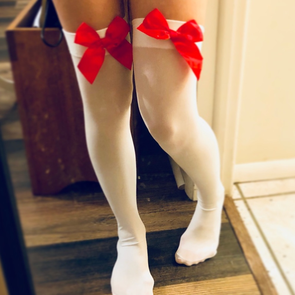 Knee-high white socks with red bow